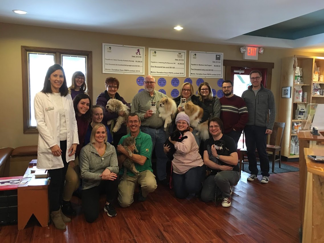 WTVC Team members photo each one holding a dog or cat